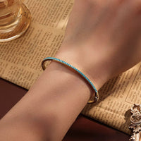 Pulsera Tenis Dorado y Turquesa